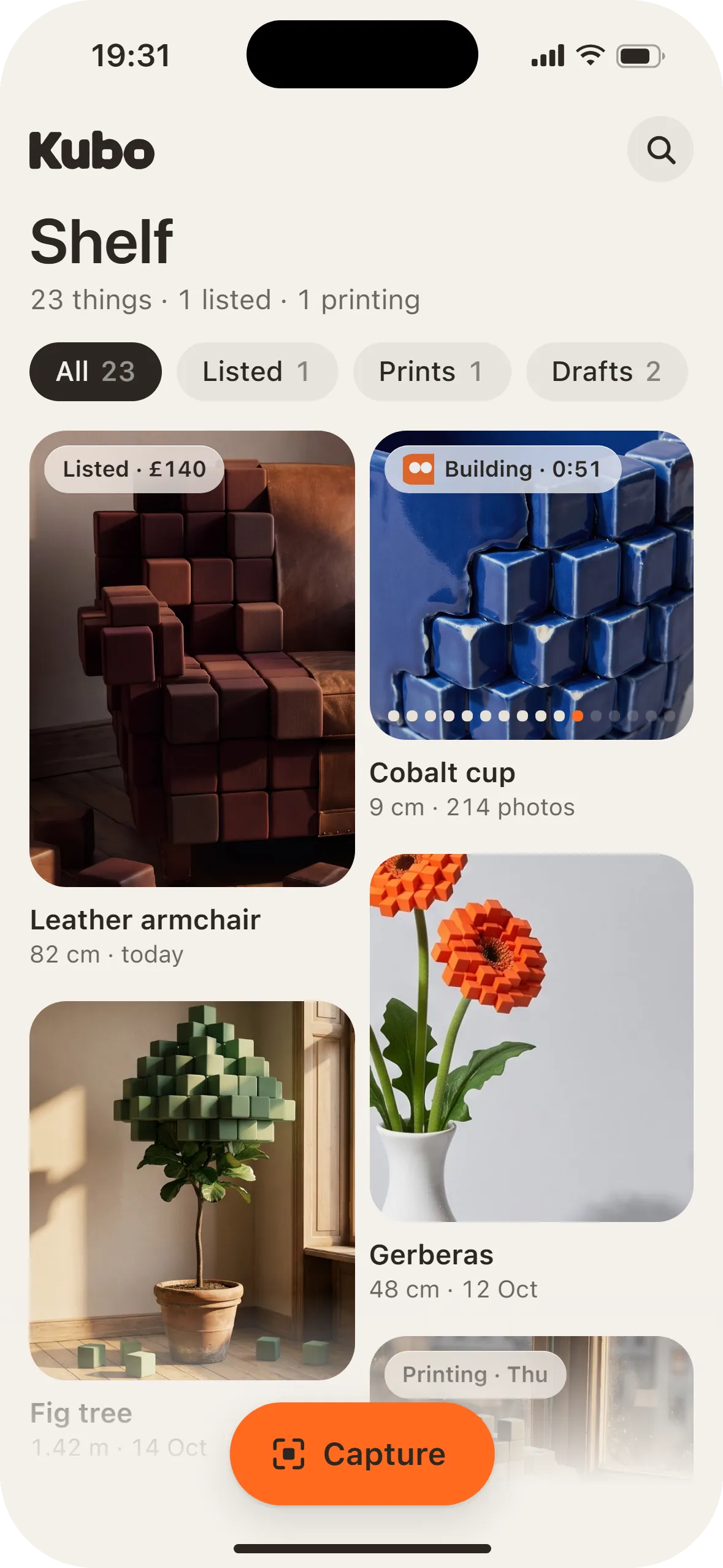 The Shelf: an armchair, a cobalt cup building, gerberas and a fig