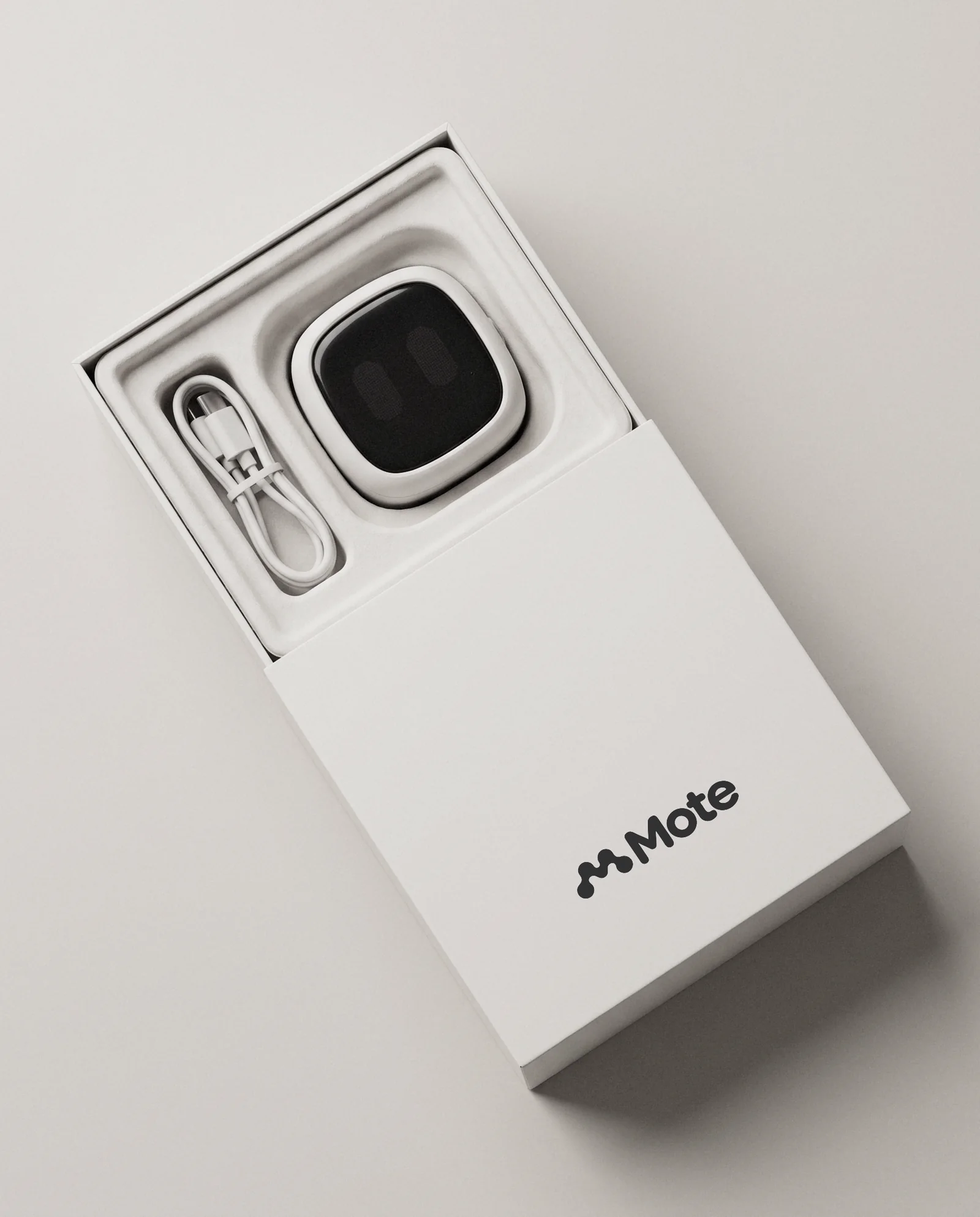 The Mote retail box, sleeve off, a Mote body inside