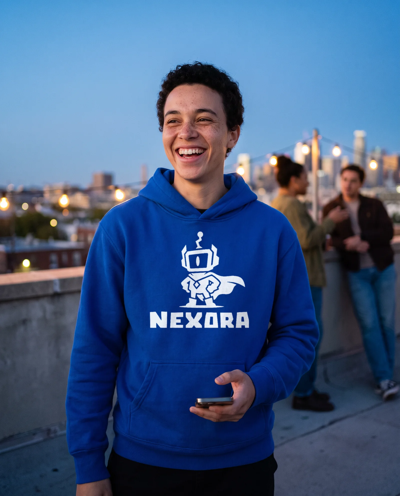 A player in a Nexora hoodie on a rooftop
