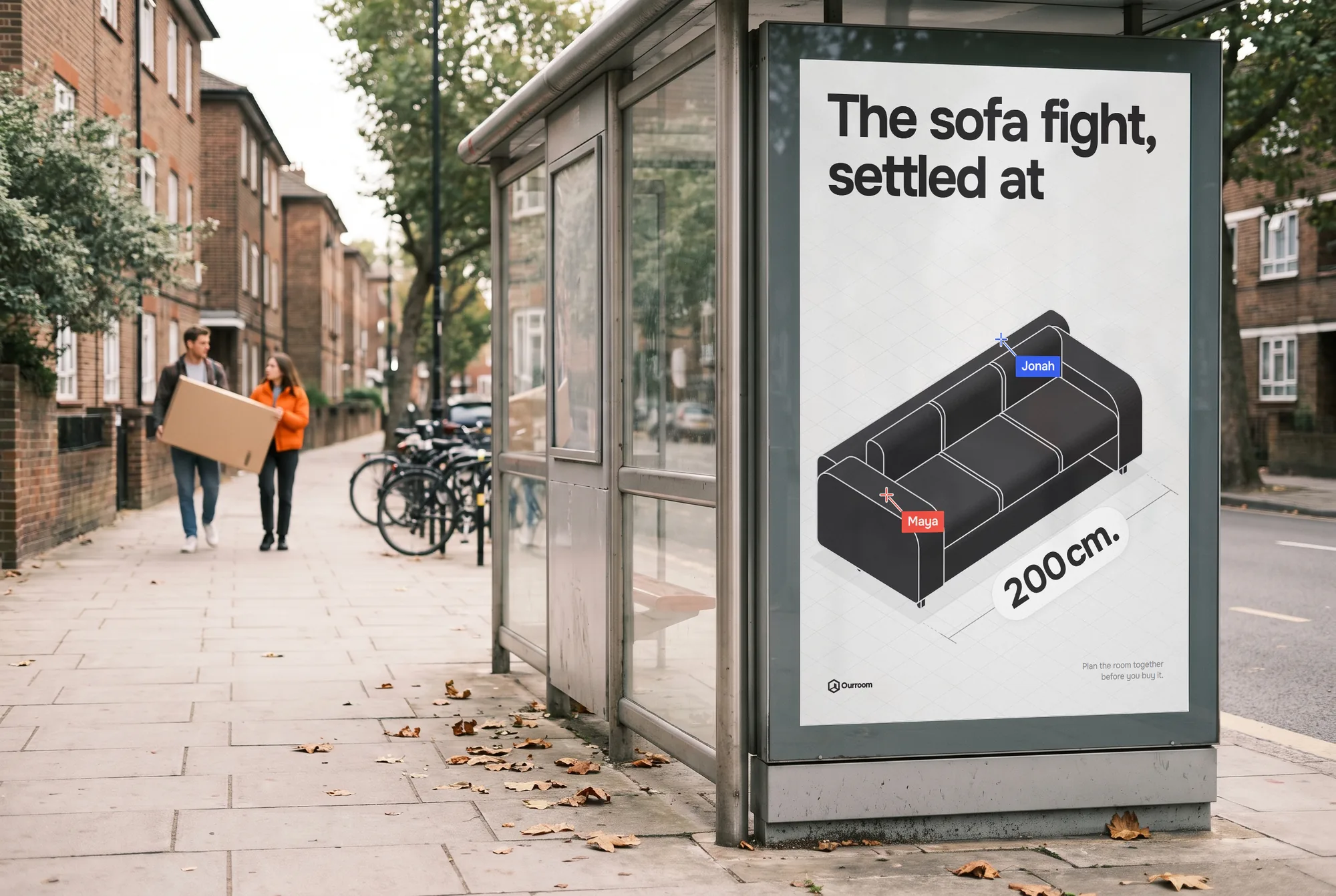 The 200 cm poster in a bus shelter on a residential street, a couple carrying a flat-pack box behind it