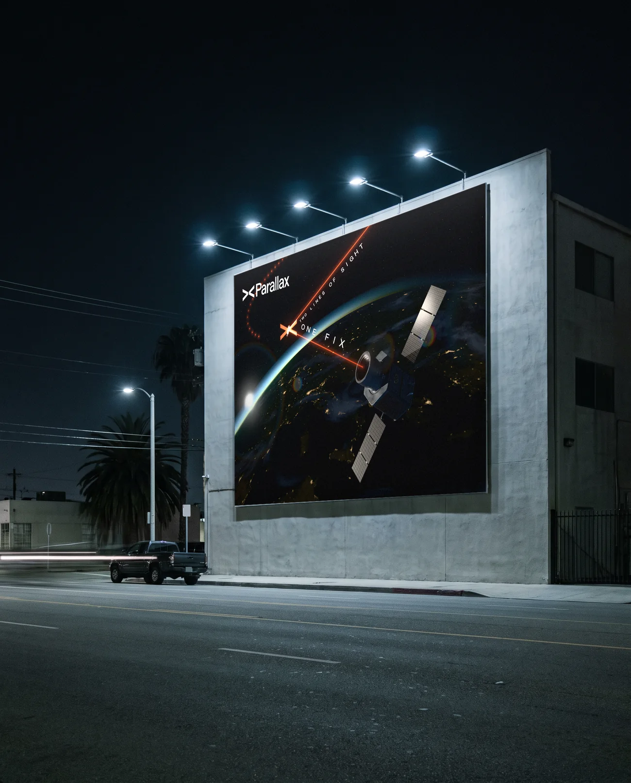 A wall billboard at night carrying the Parallax artwork: Earth's limb, the Witness, the fix and the lockup