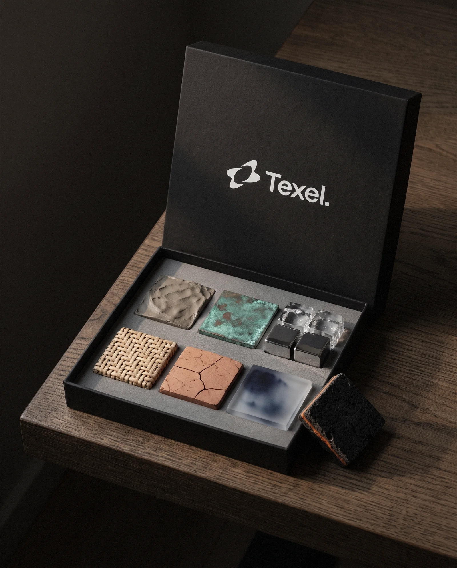 An open black box of physical material samples with the Texel lockup on the lid