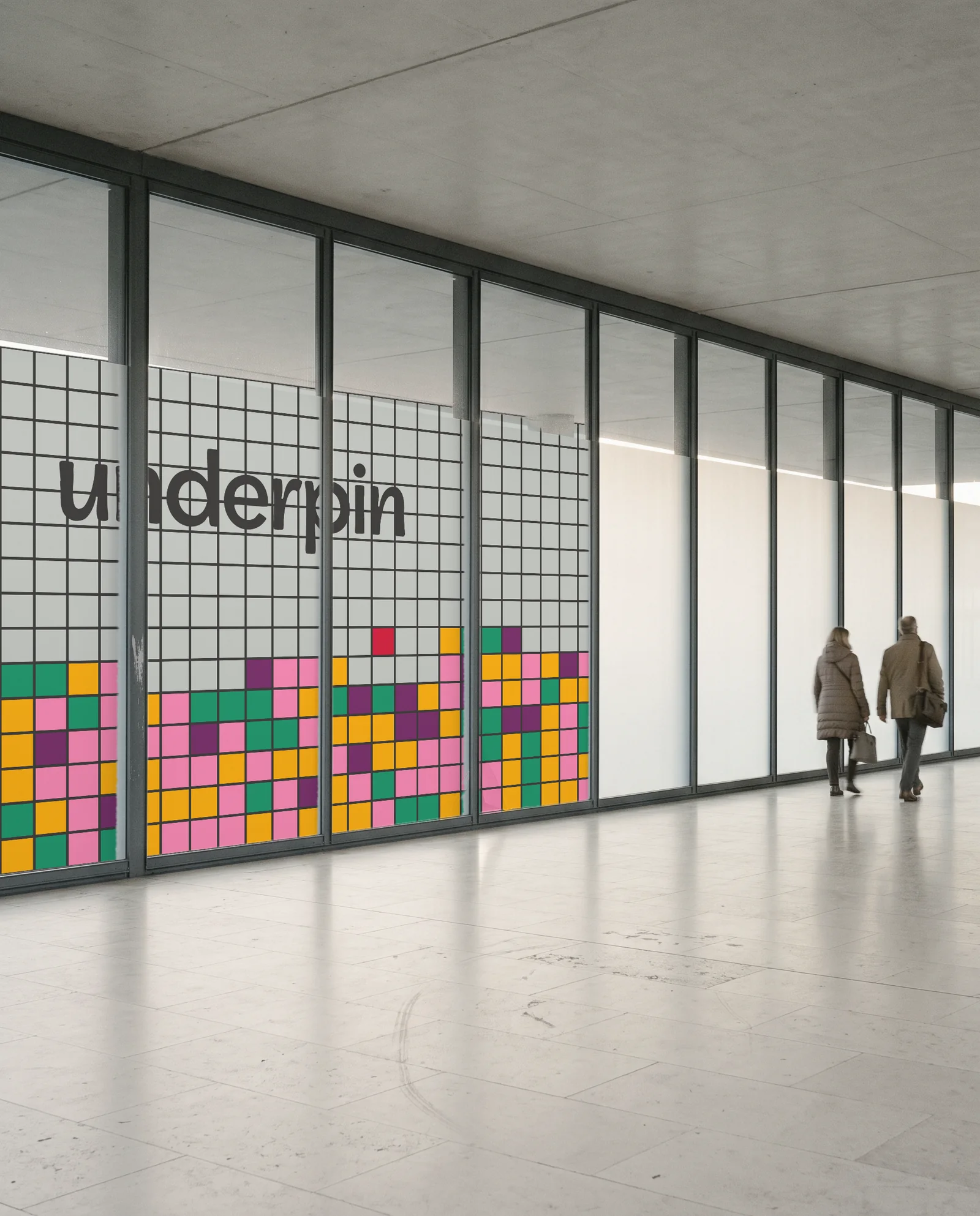 Glass panels in a concourse wrapped in Underpin pane film