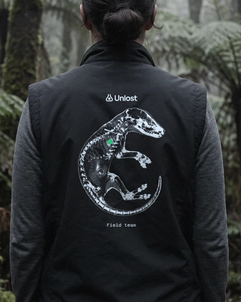 The back of a field team vest: the mark and a cleared thylacine printed in glass ink